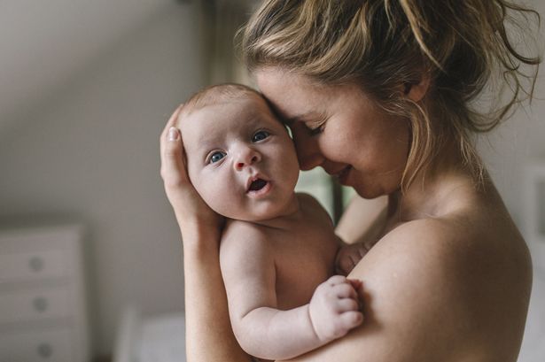 Mother with baby boy at home min